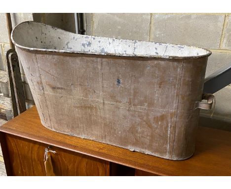A vintage painted tin bath, height 55cm