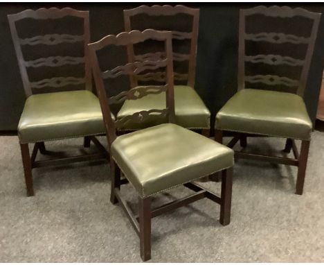 A set of four early 20th century mahogany dining chairs, pierced ladder back splats, leather seats, H-stretcher,(4) 
