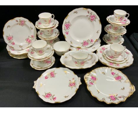 A Royal Crown Derby Royal Pinxton Roses pattern tea set for eight inc oval bowl, cake stands, bread plate, cups, saucers etc.