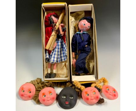 A Pelham SS range Puppet, Red Riding Hood;  another Sailor Boy, both boxed;  painted dolls spare parts, faces, assorted colou