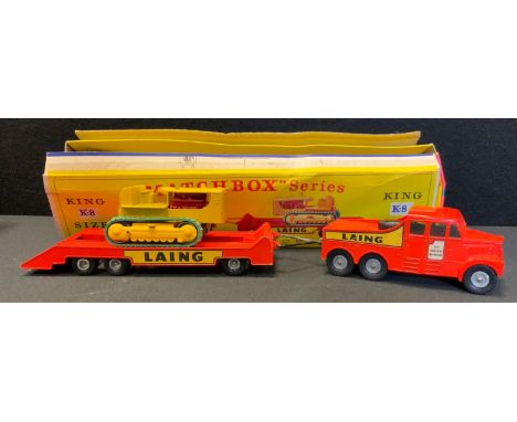 A Matchbox King size K-8 Laing Scammell 6x6 tractor and trailer transporter with caterpillar tractor, vibrant orange and yell