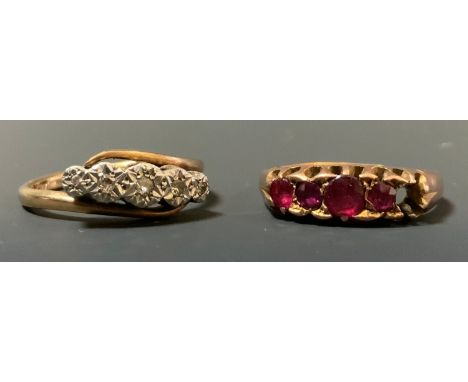 Rings - a diamond line ring, illusion crest, stamped gold plat, 2.6g gross;  a ruby line ring, 18ct gold shank, 2.3g gross. 