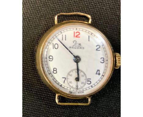 An early 20th century Record 9ct gold cased watch head, white enamel dial, Arabic numerals, subsidiary seconds, manual wind m