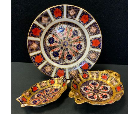 Royal Crown Derby - an 1128 Imari circular plate, 21.5cm diameter;  shaped oval trinket dish;  bonbon dish, part seconds (3) 