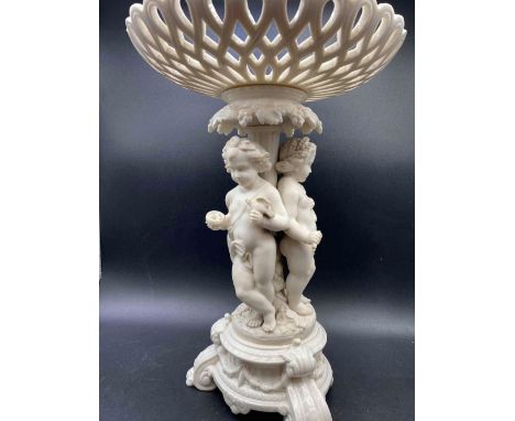 A Worcester style comport with three cherubs to base 15 ½ inches high