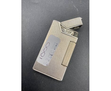 A silver DUNHILL petrol lighter