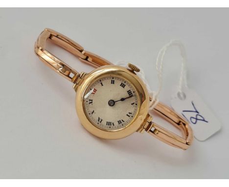 A vintage 9ct watch on original 9ct strap appears working