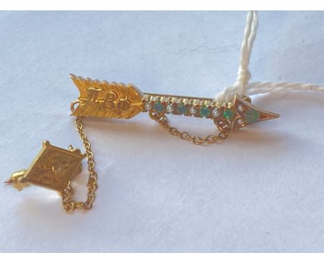 A Russian arrow double brooch set with emeralds and pearls numbered in yellow metal