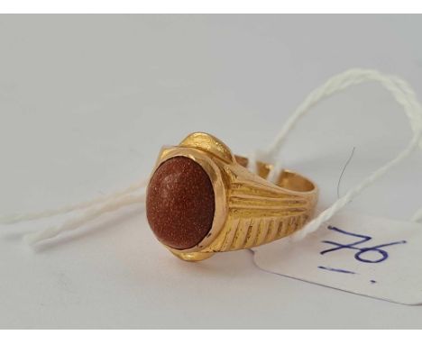 A brown stone ring mounted in 18ct gold size J 4.7g inc