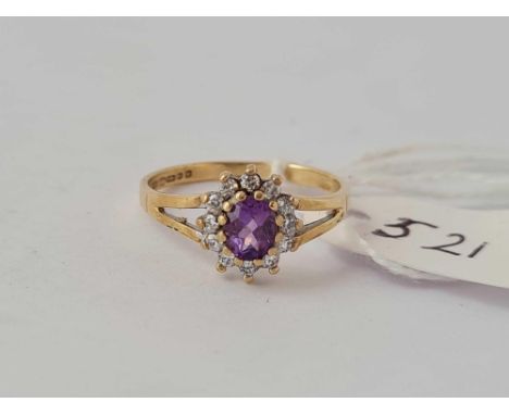 A amethyst and diamond ring 9ct size M       1.5 gms