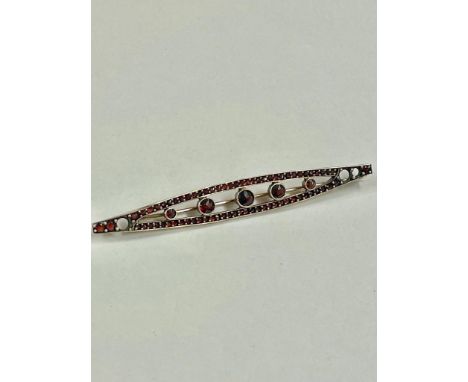 Vintage large garnet and yellow metal brooch 