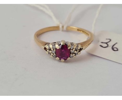A ruby and diamond ring 9ct size K    