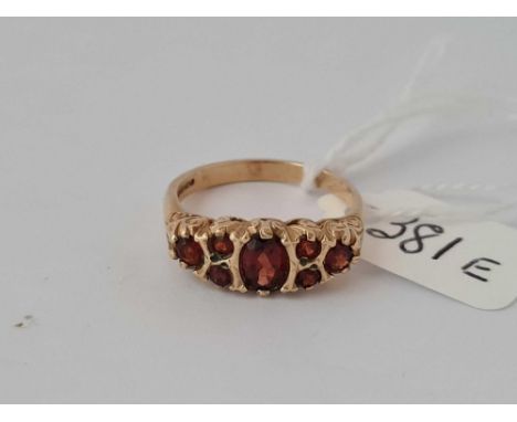 A seven stone garnet ring 9ct size P    3.2 gms