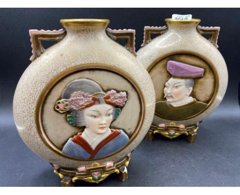 A good pair of Royal Worcester oriental style vases moon shaped 8 ½ inches high