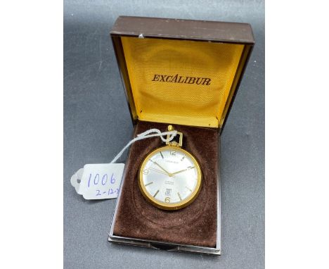 A slim ladies EXCALIBUR gilt fob watch with seconds sweep and date aperture W/O in original box