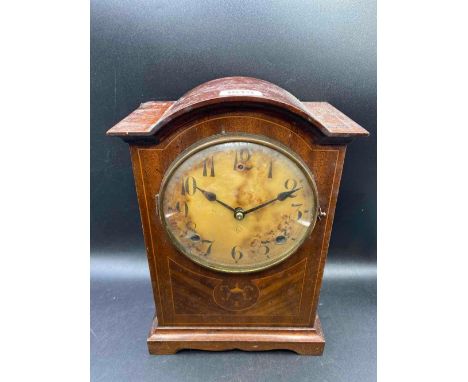A inlaid mahogany mantel clock with circular dial 11 inches high