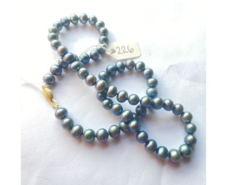 A matched gray pearl necklace with 9ct clasp
