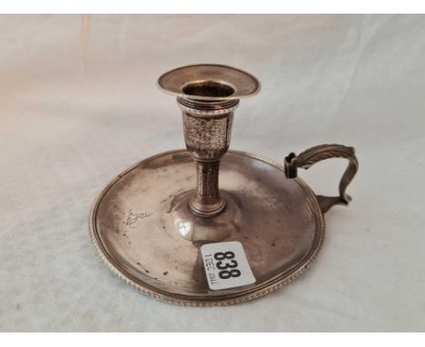 An Early George III chamber candlestick with gadroon rim, London 1773 by IC, 203g