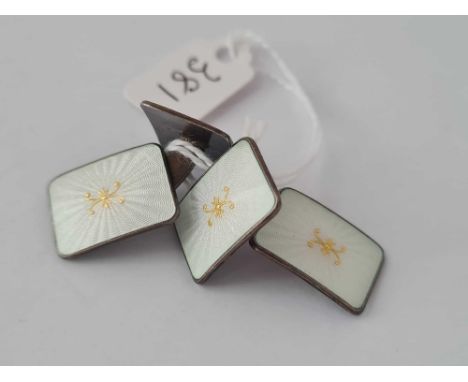 A pair of silver and enamel cufflinks