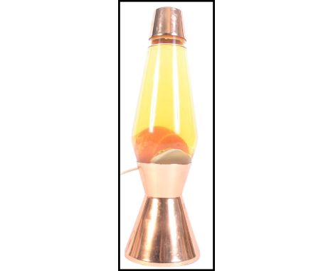 An original vintage retro 1960's ' Astro ' lava lamp by Crestworthy of Poole, England. Copper effect with yellow lava and liq