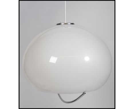 A retro 20th century Harvey Guzzini of Italy milk white plastic ceiling lamp. The white plastic shade of globe form with rece