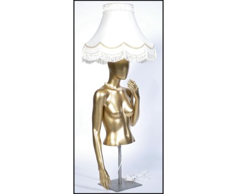 A vintage 20th century up-cycled mannequin tall table lamp - floor lamp. Chrome base with gold mannequin up-cycled with shade