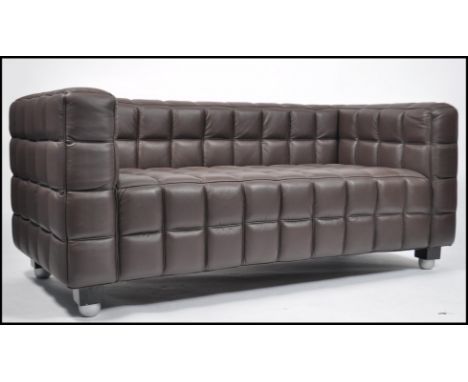 A Scandinavian / Danish revival contemporary brown leather quilt sofa of square form raised on black and turned legs having a