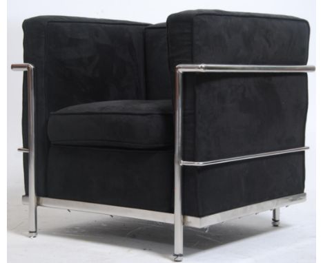 After Le Corbusier. An unusual childs ' LC2 ' type black suede and chrome armchair. The polished chrome tubular frame with &n