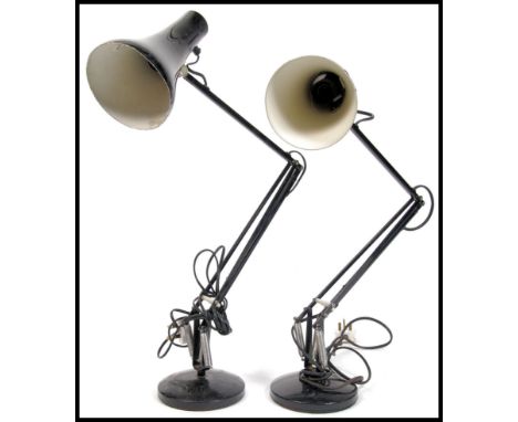 A pair of mid century black Herbert Terry Type 90 Industrial anglepoise desk lamps. Raised on circular terraced bases with no