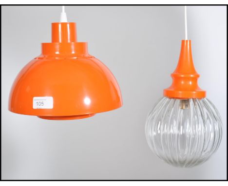 A 1970's retro original orange Minisol light by Svend Middelboe for Nording Solar together with another similar orange hangin