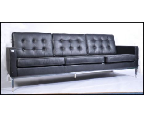 A stunning black leather and chrome large sofa &nbsp;after Florence Knoll. The &nbsp;large sofa raised on a chrome frame bein