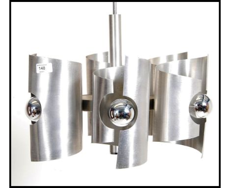 A retro 20th century modernist Panton era space age polished steel 6 cylinder chandelier ceiling light. Each cylinder shade b