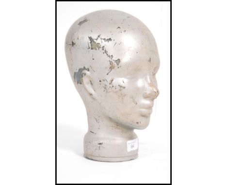 A 20th century glass painted head - shop display stand / milleners mannequin head. Moulded and pressed glass of green colour 
