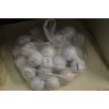 A quantity of golf balls.
