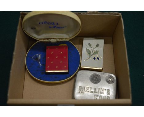 Two ladies cigarette lighter style atomisers and an advertising coin dispenser.