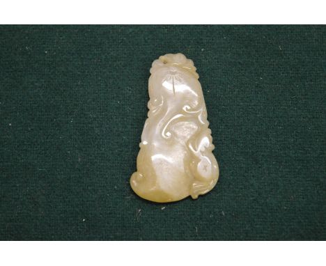 A small Chinese carved jade pendant.