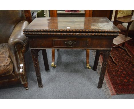 A Chippendale period mahogany rectangular fold-over combination card/tea table.