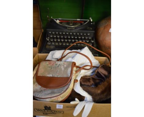 Various textiles, gloves etc and an old typewriter.