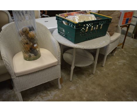 Modern pair of lloyd loom armchairs with matching two-tier table.