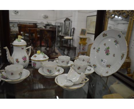 A Herend porcelain part coffee service comprising small coffee pot, sugar bowl and cover, six cups and saucers and a cake pla