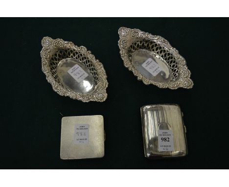 A silver cigarette case, a silver compact and a pair of silver bonbon dishes.