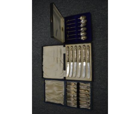 A cased set of six sterling silver coffee spoons with animal and bird finials together with a cased set of butter knives with