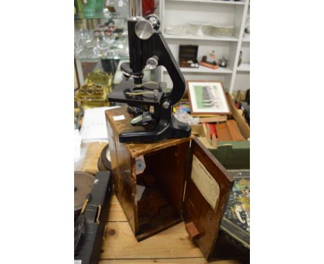 A cased microscope.
