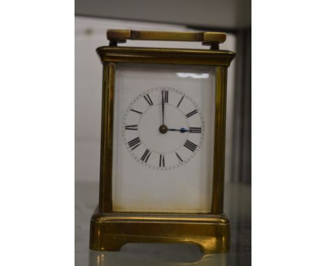 A brass carriage clock.