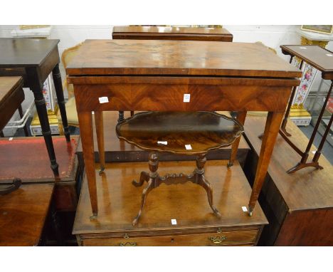 A mahogany rectangular fold-over card table.