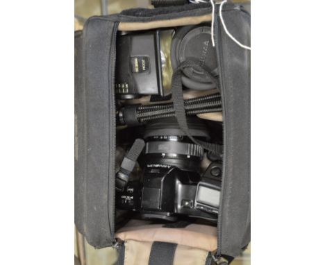 A Minolta camera and accessories.