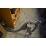 A large cast iron lantern bracket and various parts.