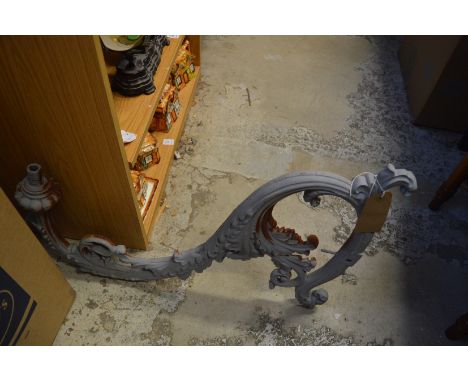 A large cast iron lantern bracket and various parts.