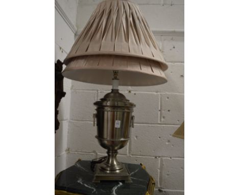 An urn shaped table lamp with pleated shade and spare shade.