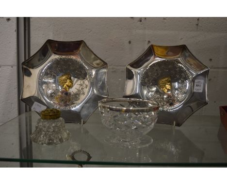 A cut glass bowl with silver rim, pair of Royal Commemorative white metal dishes and an inkwell.